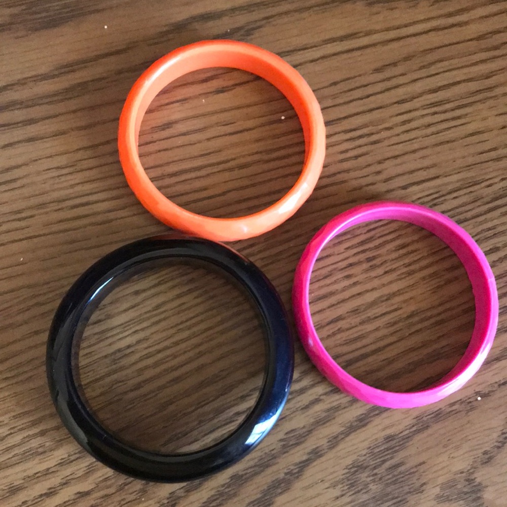 3 bracelets: black, pink and orange